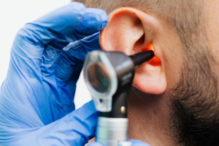 Do I Need Urgent Care for a Sinus Infection? 1 Patient holding tissue to forehead during ear and sinus infection evaluation