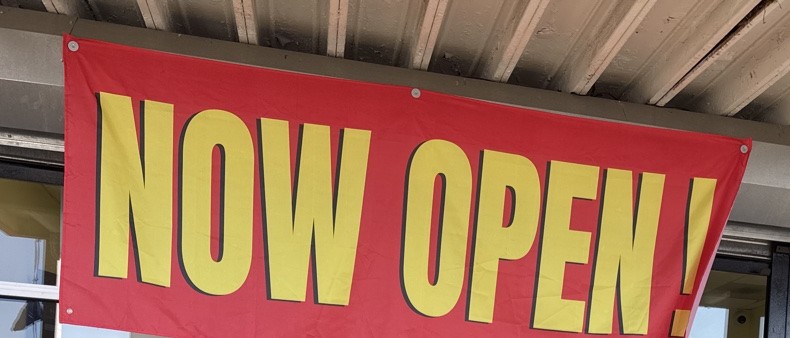 Vital Urgent Care storefront with Now Open banner